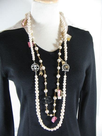 chanel long white pearl eiffel tower charm necklace|Chanel jewelry.